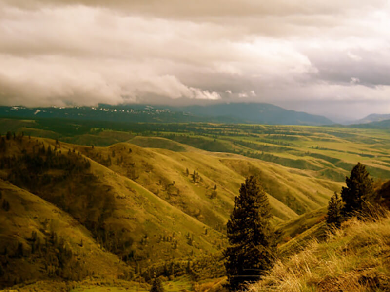 A picture of beautiful white clouds over the hills